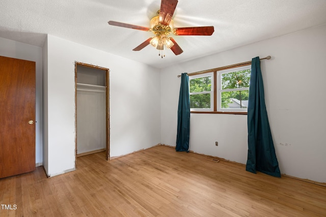 218 Forestville Rd, Wake Forest, NC 27587 - unfurnished bedroom featuring light wood-style floors, a closet, and ceiling fan