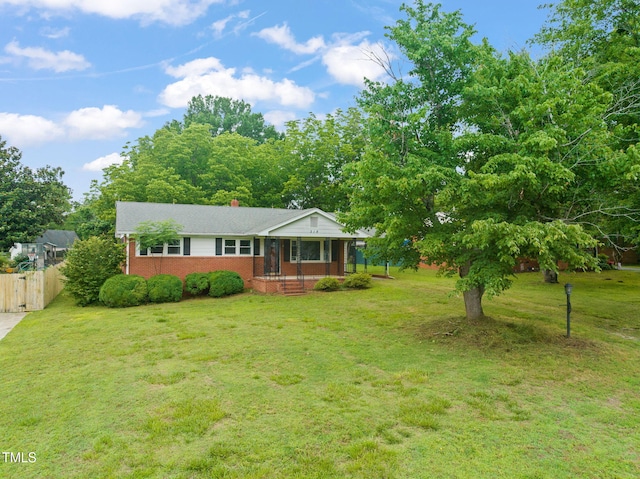 218 Forestville Rd, Wake Forest, NC 27587 - view of front facade with brick siding and a chimney