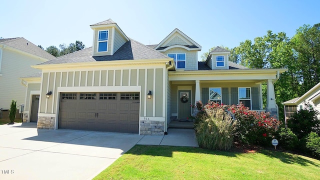 966 Airedale Trl, Garner, NC 27529 - craftsman-style home with an attached garage, board and batten siding, driveway, a front lawn, and roof with shingles