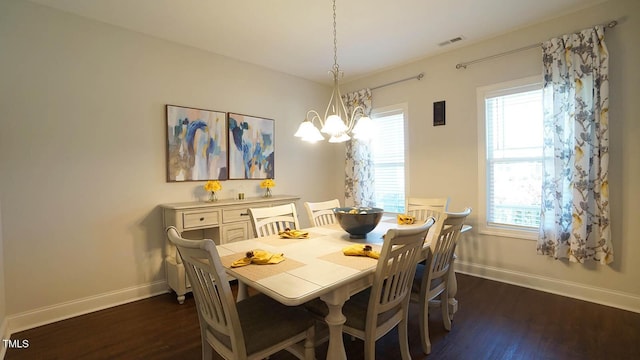 966 Airedale Trl, Garner, NC 27529 - dining area with dark wood-style flooring and a chandelier