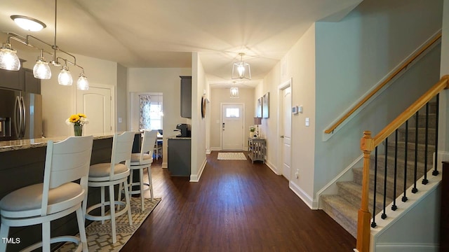 966 Airedale Trl, Garner, NC 27529 - entryway featuring dark wood-style floors and stairs