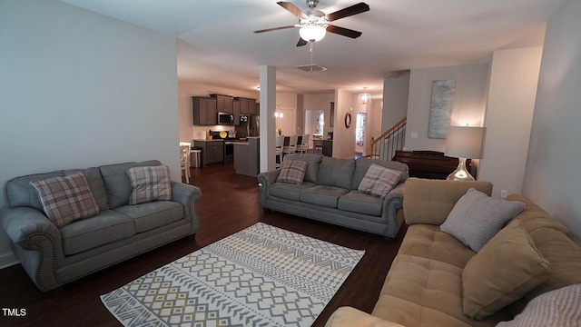 966 Airedale Trl, Garner, NC 27529 - living area featuring a ceiling fan, dark wood-style flooring, and stairway