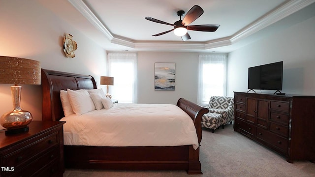 966 Airedale Trl, Garner, NC 27529 - bedroom featuring multiple windows, light carpet, ornamental molding, a tray ceiling, and ceiling fan