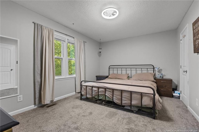 6108 Lonestar Rd, Fayetteville, NC 28303 - carpeted bedroom featuring a textured ceiling and baseboards