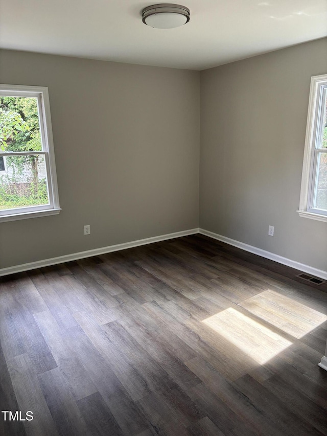 510 N St, Graham, NC 27253 - unfurnished room featuring dark wood-style floors and baseboards
