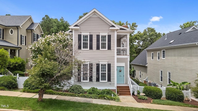 124 Kingsport Rd, Holly Springs, NC 27540 - view of front facade with a chimney, entry steps, and a balcony
