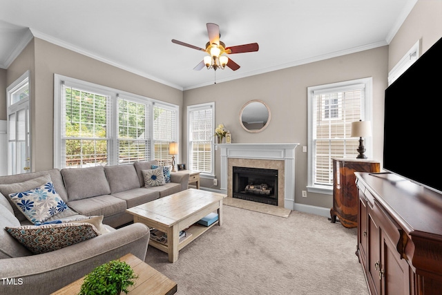 124 Kingsport Rd, Holly Springs, NC 27540 - living room with a ceiling fan, crown molding, healthy amount of natural light, a high end fireplace, and light colored carpet