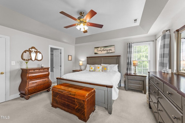 124 Kingsport Rd, Holly Springs, NC 27540 - bedroom with light carpet, ceiling fan, and a raised ceiling