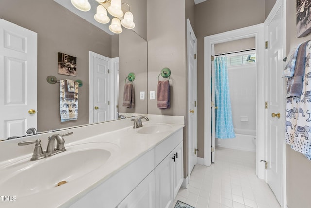124 Kingsport Rd, Holly Springs, NC 27540 - full bath featuring double vanity, tile patterned floors, a chandelier, and shower / bath combo with shower curtain