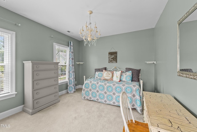 124 Kingsport Rd, Holly Springs, NC 27540 - carpeted bedroom with a chandelier and baseboards