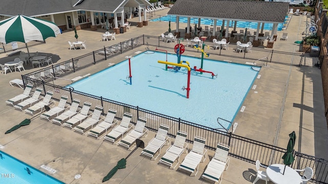 124 Kingsport Rd, Holly Springs, NC 27540 - community pool with a water play area and a patio