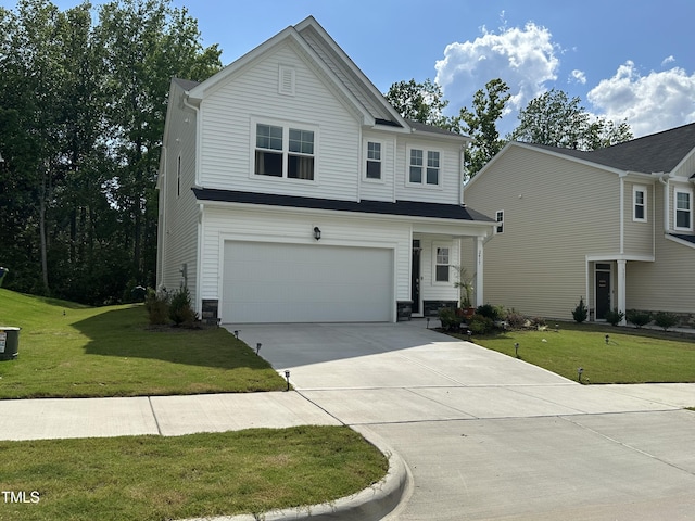 2417 Tobacco Root Dr, Raleigh, NC 27616 - view of front of home with a garage, driveway, and a front lawn