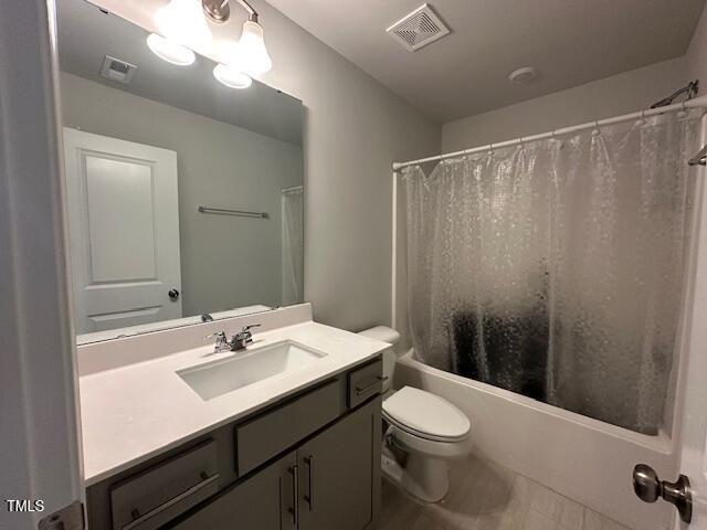 2417 Tobacco Root Dr, Raleigh, NC 27616 - bathroom with vanity and shower / bathtub combination with curtain
