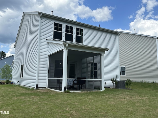 2417 Tobacco Root Dr, Raleigh, NC 27616 - rear view of house featuring a sunroom and a lawn