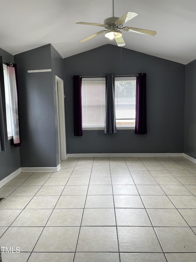 3129 Skycrest Dr, Raleigh, NC 27604 - empty room with vaulted ceiling, a ceiling fan, and light tile patterned floors