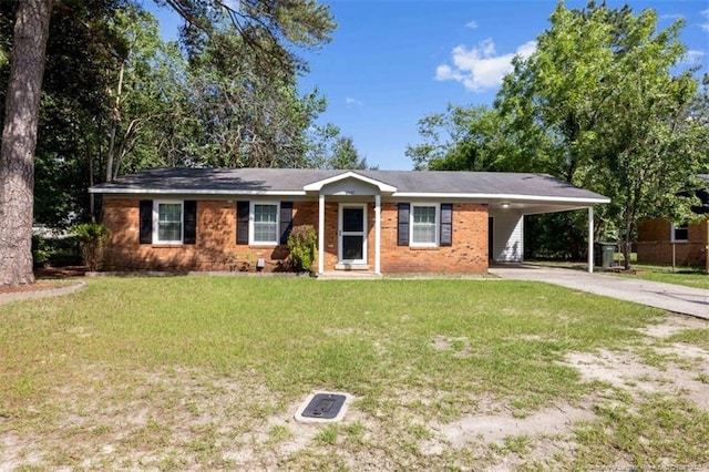 6547 Amanda Cir, Fayetteville, NC 28304 - ranch-style house with driveway, a front lawn, an attached carport, and brick siding