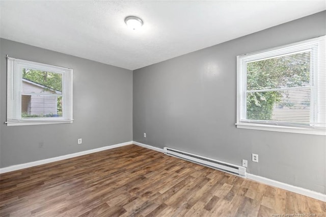 6547 Amanda Cir, Fayetteville, NC 28304 - unfurnished room with baseboard heating and wood finished floors