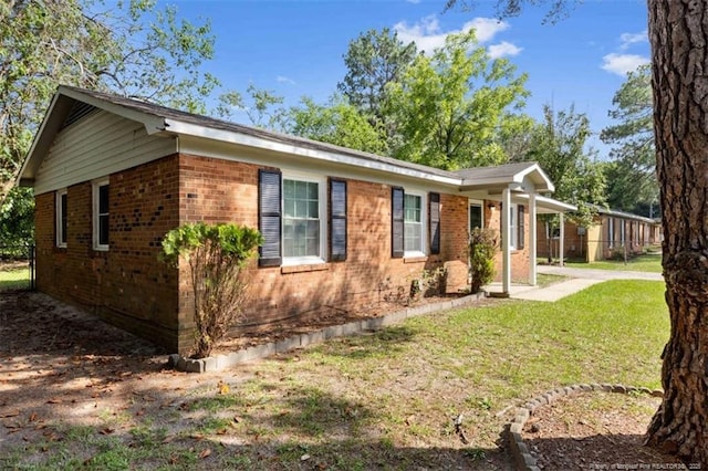 6547 Amanda Cir, Fayetteville, NC 28304 - view of front of property featuring brick siding and a front lawn