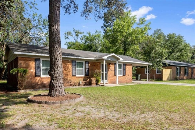 6547 Amanda Cir, Fayetteville, NC 28304 - ranch-style home with driveway, an attached carport, a front lawn, and brick siding