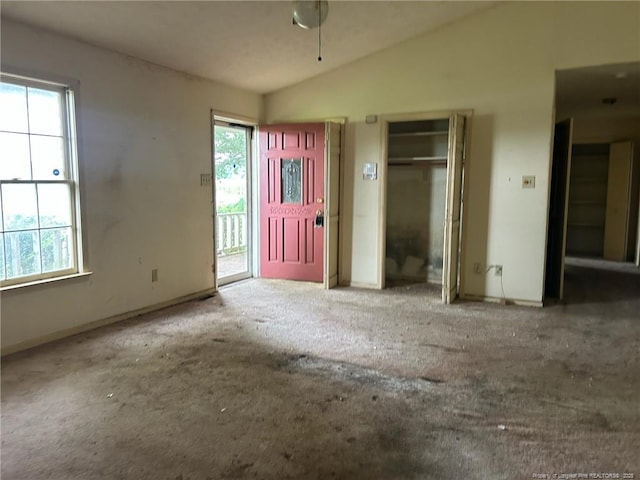 1580 Arthur Rd, Red Springs, NC 28377 - foyer entrance featuring vaulted ceiling, carpet flooring, and plenty of natural light