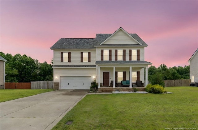 229 Red Oak Ct, Raeford, NC 28376 - view of front of property with covered porch, driveway, an attached garage, and a shingled roof