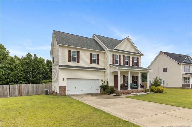 229 Red Oak Ct, Raeford, NC 28376 - view of front of home with a porch, concrete driveway, and a garage