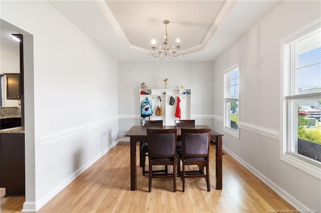 229 Red Oak Ct, Raeford, NC 28376 - dining space featuring a chandelier, light wood finished floors, and a raised ceiling