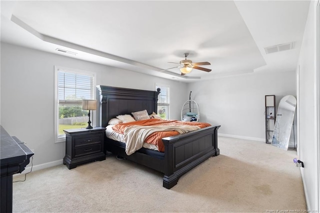 229 Red Oak Ct, Raeford, NC 28376 - bedroom with a raised ceiling, carpet flooring, and a ceiling fan