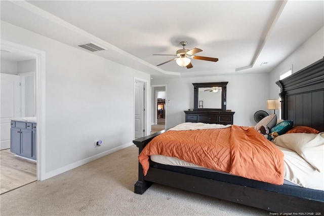 229 Red Oak Ct, Raeford, NC 28376 - bedroom with light carpet, ceiling fan, and a raised ceiling