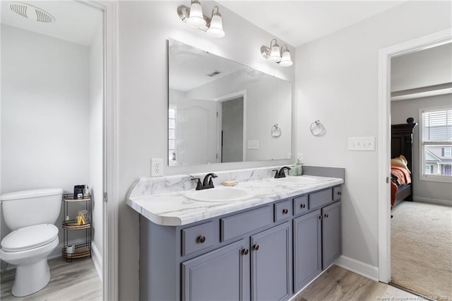 229 Red Oak Ct, Raeford, NC 28376 - bathroom featuring connected bathroom, double vanity, and wood finished floors