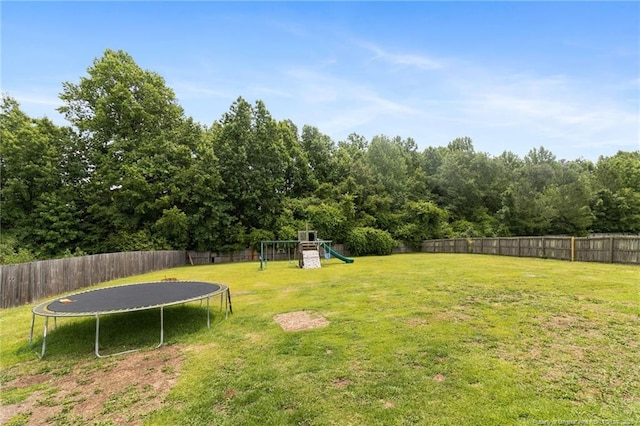 229 Red Oak Ct, Raeford, NC 28376 - fenced backyard with a trampoline and a playground