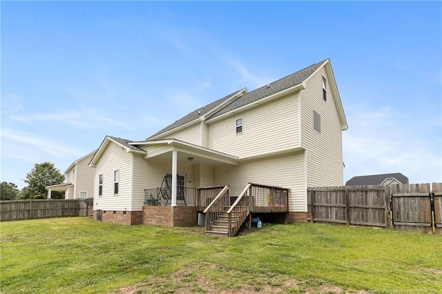 229 Red Oak Ct, Raeford, NC 28376 - back of property with a fenced backyard, a wooden deck, and stairs