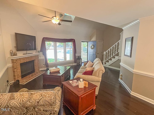 5500 Fortunes Ridge Dr Unit 94C, Durham, NC 27713 - living area featuring lofted ceiling, wood finished floors, ceiling fan, a brick fireplace, and stairs