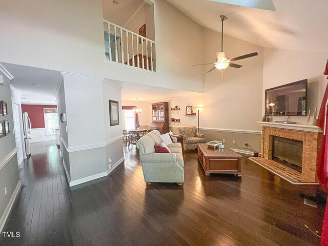 5500 Fortunes Ridge Dr Unit 94C, Durham, NC 27713 - living area featuring hardwood / wood-style flooring, ceiling fan, a fireplace, and high vaulted ceiling