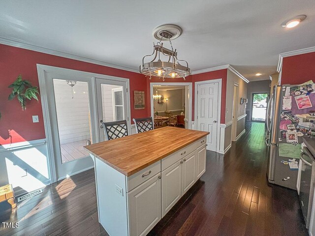 5500 Fortunes Ridge Dr Unit 94C, Durham, NC 27713 - kitchen with wood counters, ornamental molding, white cabinets, dark wood finished floors, and a center island