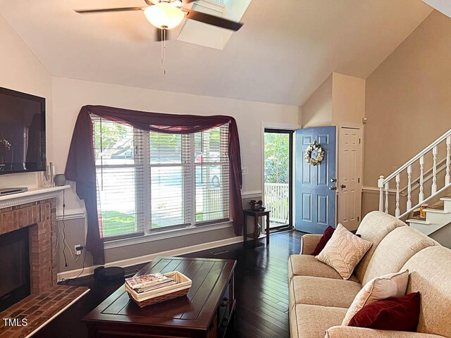 5500 Fortunes Ridge Dr Unit 94C, Durham, NC 27713 - living area featuring a fireplace, ceiling fan, healthy amount of natural light, stairs, and high vaulted ceiling