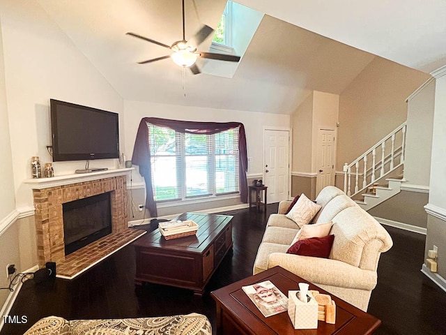 5500 Fortunes Ridge Dr Unit 94C, Durham, NC 27713 - living room featuring lofted ceiling, a ceiling fan, wood finished floors, a brick fireplace, and stairs