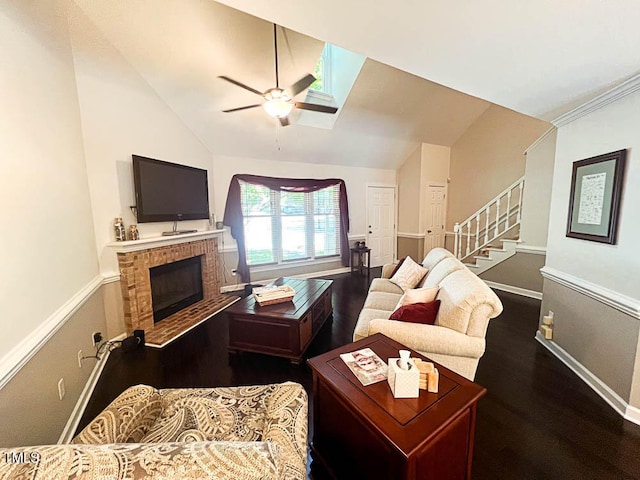 5500 Fortunes Ridge Dr Unit 94C, Durham, NC 27713 - living area featuring ceiling fan, dark wood-style floors, a brick fireplace, stairway, and high vaulted ceiling