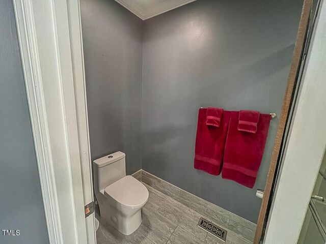 5500 Fortunes Ridge Dr Unit 94C, Durham, NC 27713 - bathroom with toilet and crown molding