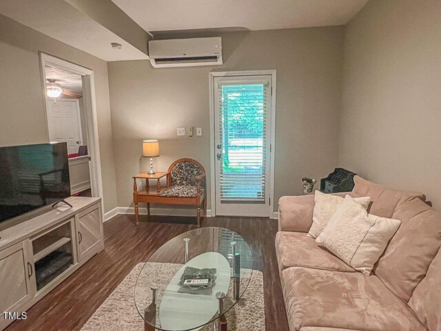 5500 Fortunes Ridge Dr Unit 94C, Durham, NC 27713 - living area featuring an AC wall unit and dark wood-style flooring
