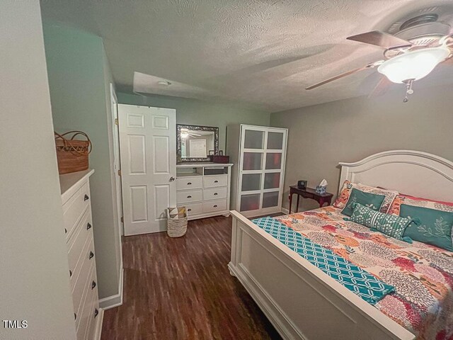 5500 Fortunes Ridge Dr Unit 94C, Durham, NC 27713 - bedroom featuring dark wood-style flooring, a textured ceiling, and ceiling fan