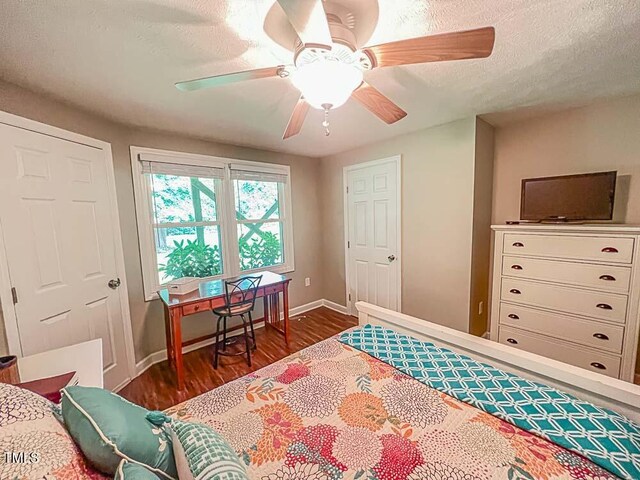 5500 Fortunes Ridge Dr Unit 94C, Durham, NC 27713 - bedroom featuring dark wood finished floors, a textured ceiling, and a ceiling fan