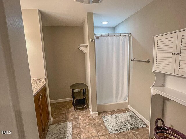 5500 Fortunes Ridge Dr Unit 94C, Durham, NC 27713 - full bath featuring a stall shower and vanity