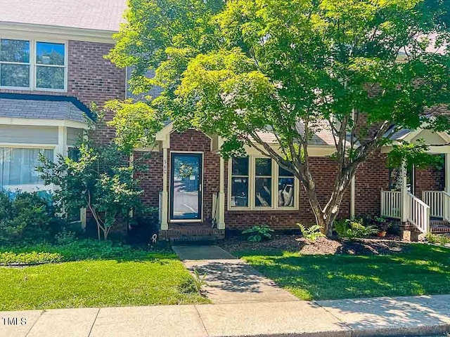 5500 Fortunes Ridge Dr Unit 94C, Durham, NC 27713 - view of front of home featuring a front yard and brick siding