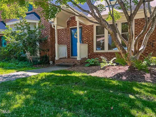 5500 Fortunes Ridge Dr Unit 94C, Durham, NC 27713 - view of front of house featuring brick siding and a front lawn
