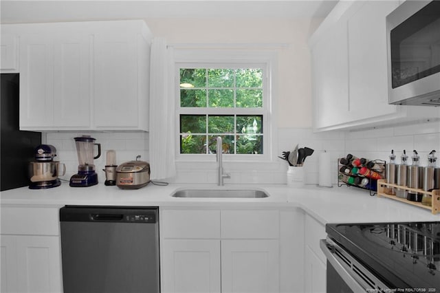 262 Shads Ford Blvd, Fayetteville, NC 28314 - kitchen with stainless steel appliances, white cabinets, and light countertops