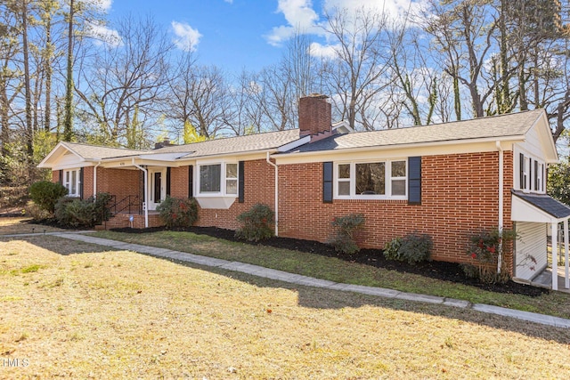 420 Nelson St, Durham, NC 27707 - ranch-style house with a chimney, brick siding, a front lawn, and roof with shingles