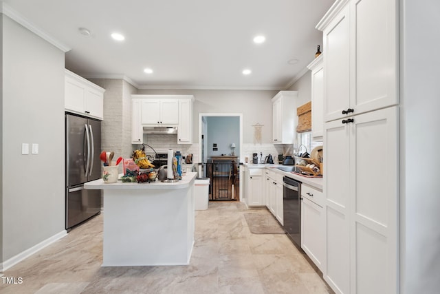 5405 Doemont Dr, Apex, NC 27539 - kitchen with stainless steel appliances, under cabinet range hood, ornamental molding, tasteful backsplash, and white cabinetry