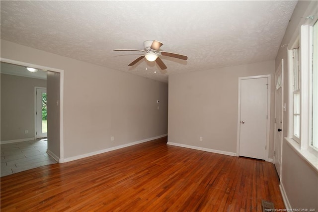 6310 Glenlea Cir, Fayetteville, NC 28314 - unfurnished room featuring a textured ceiling, ceiling fan, and wood finished floors
