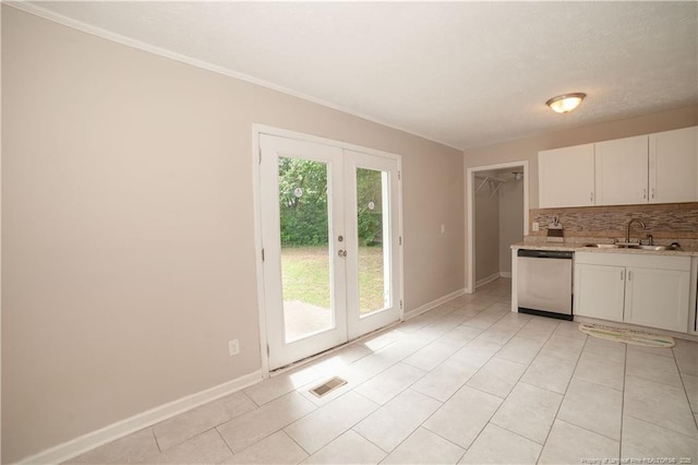 6310 Glenlea Cir, Fayetteville, NC 28314 - kitchen featuring dishwasher, french doors, decorative backsplash, white cabinetry, and ornamental molding